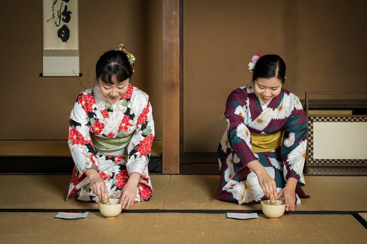Tea master preparing matcha during a premium Kyoto tea ceremony