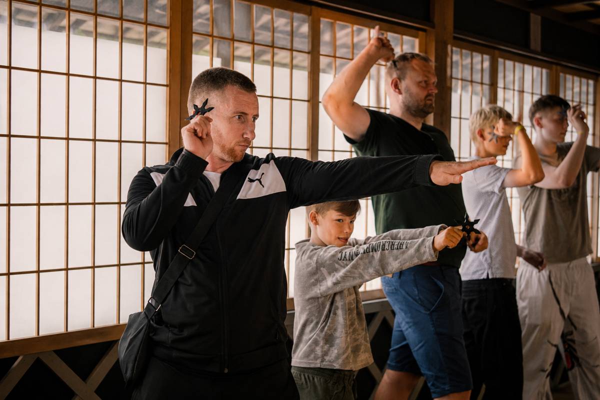 A family enjoying ninja star throwing