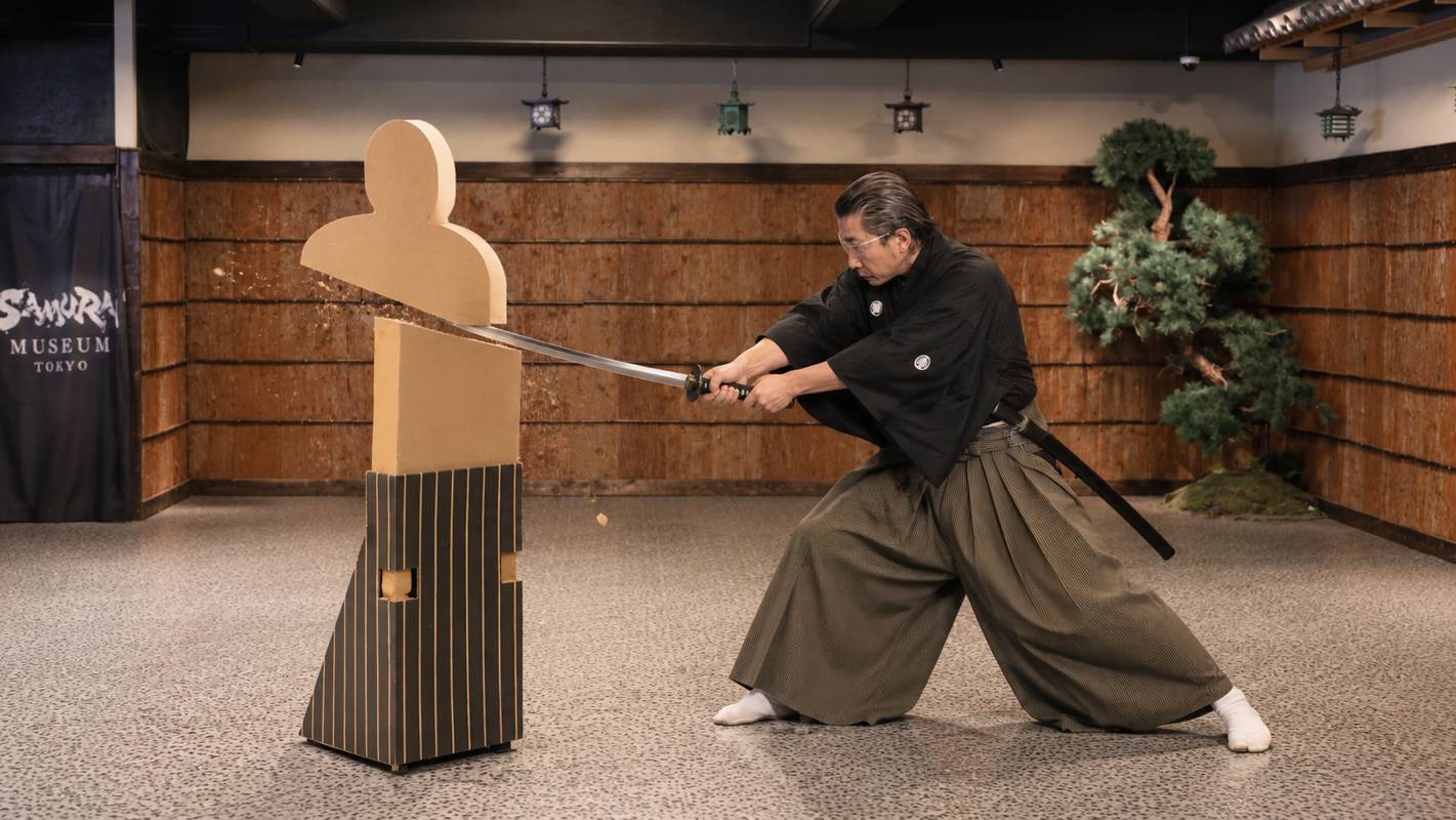Samurai demonstrating target cutting in the dojo