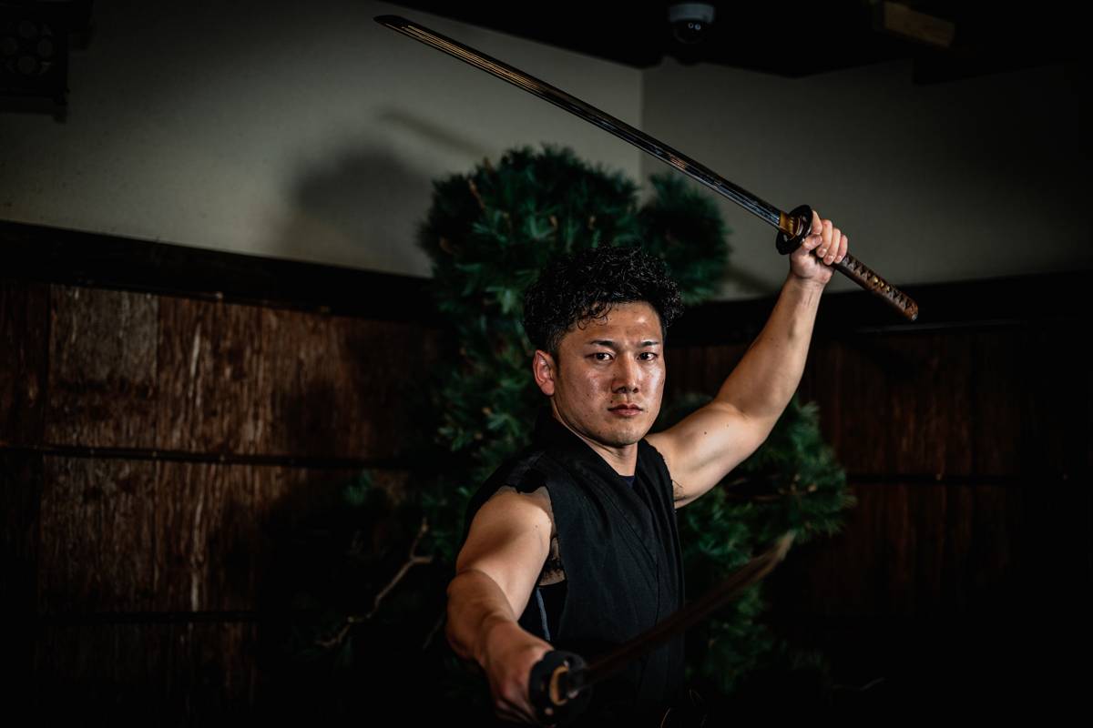 Family training with katana during the samurai experience at the Samurai Ninja Museum Tokyo