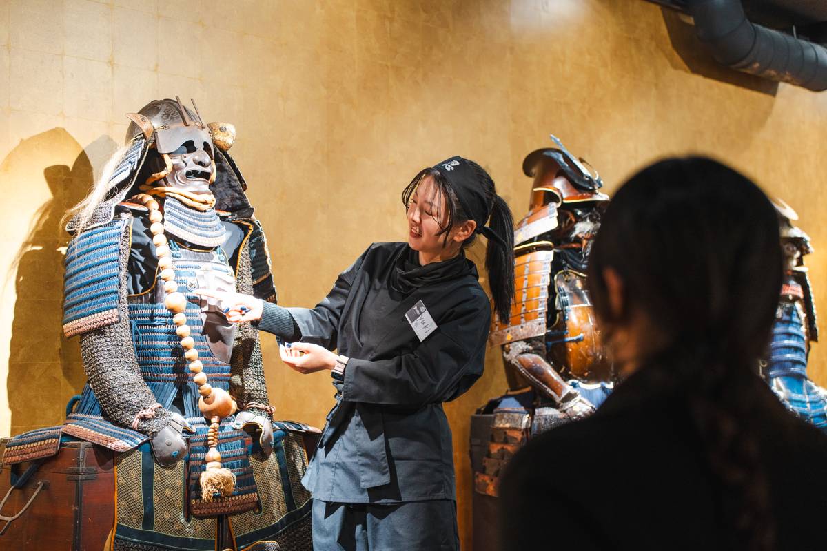 A guide introducing museum exhibits to visitors